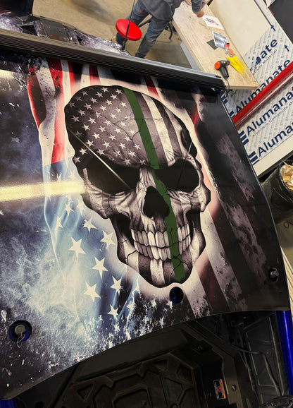 Polaris Pro R 2 seater UTV with American flag skull wrap design on roof